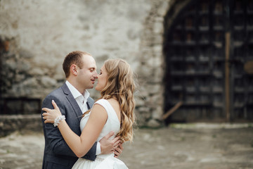 Wedding couple. Pretty bride and stylish groom.