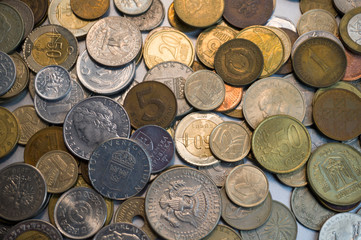 Collection of different coins background. Close up.