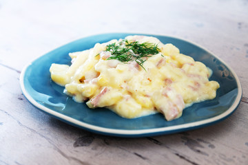 Gratin Of Potatoes, Ham, Eggs And Onions