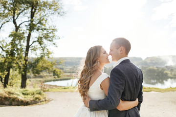 Obraz premium Wedding couple. Pretty bride and stylish groom.
