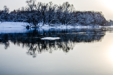 The floe floats down the river. Winter nature