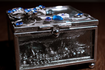 Old jewelry box with blue stones on the top