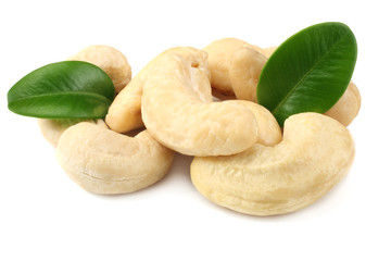cashew with green leaves isolated on white background
