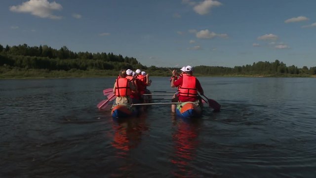 Rafting on catamarans on the river .Tourists rowing on catamarans. Outdoor activity