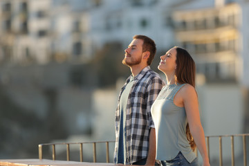 Happy couple in a town breathing fresh air
