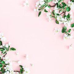 Flowers composition. Apple tree flowers on pastel pink background. Spring concept. Flat lay, top view, copy space, square