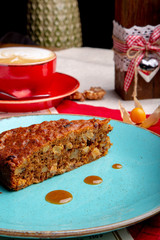 Plate with piece of delicious carrot cake and cup of coffe on table