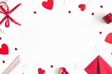 Valentine's Day background. Gifts, candle, confetti, envelope on white background. Valentines day concept. Flat lay, top view, copy space