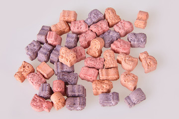 Various vitamins for kids on a white background. Studio lights. Assorted animal shaped multivitamins for kids. Chewable pills