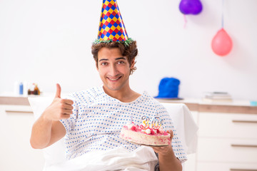 Young man celebrating his birthday in hospital