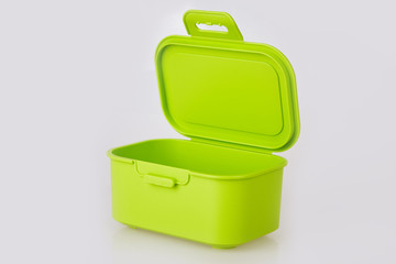 Opened empty green plastic food storage container isolated on white background