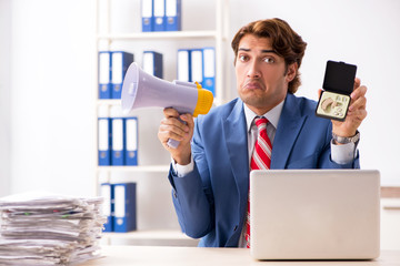 Deaf employee using hearing aid in office