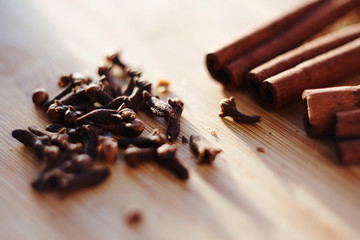 dried cloves and fragrant cinnamon are prepared to be added to mulled wine