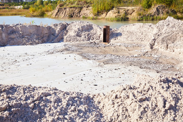 Sand quarry. Bulldozer working on sand dunes. Pure lake sand.  Old sand mining.