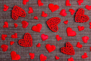 Red decorative hearts pattern on sackcloth background. Valentine's day concept.