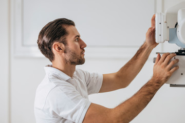 Medical Technician Operating an X-ray Machine