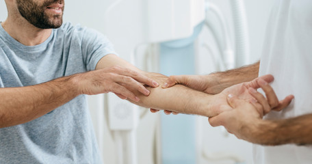Doctor Examining Patient's Hand