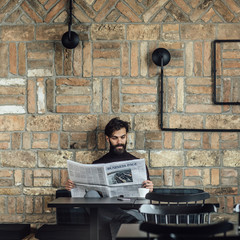 A Man Reading Daily Newspaper