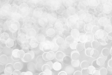 Abstract White Bokeh with soft blurred background nature blurry light party in vintage style warm pastel shimmering and faded cool colorful defocused circular. Shiny copy space for holiday card.