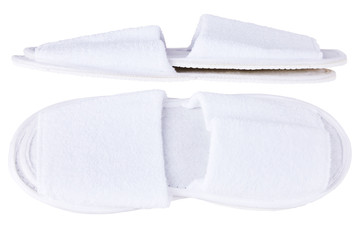 Pair of blank white home slippers. Top and bottom view. Bed shoes accessory footwear. Spa, hotel, wellness - home and hotel slippers isolated