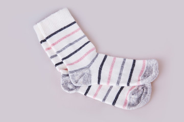 Pair of striped socks on the white background