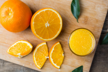 Obraz na płótnie Canvas Top view of fresh orange juice with slice of fresh orange