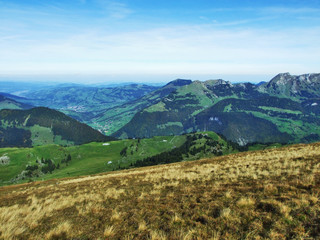 Autumn pastures and hills on the plateau beneath the mountain ranges Churfirsten - Canton of St....
