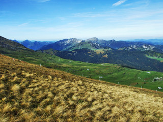 Autumn pastures and hills on the plateau beneath the mountain ranges Churfirsten - Canton of St....