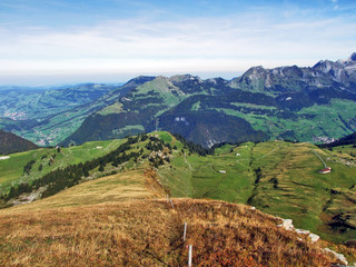 Autumn pastures and hills on the plateau beneath the mountain ranges Churfirsten - Canton of St....