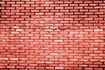 Toned Coral color brick wall texture grunge background.