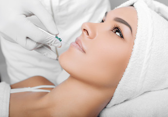 cropped woman face getting facelift , procedure lifting skin