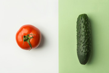 Ripe raw organic tomato cucumber on duotone white light green color combination background....