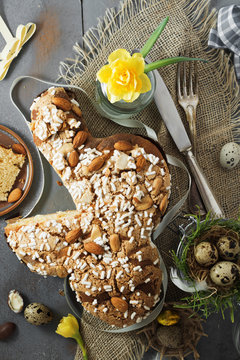Colomba - italian easter dove cake on old rustic grey board. Selective focus, free text space.