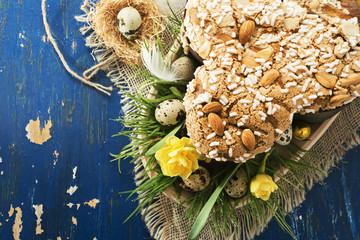 Colomba - italian easter dove cake on old rustic grey board. Selective focus, free text space.