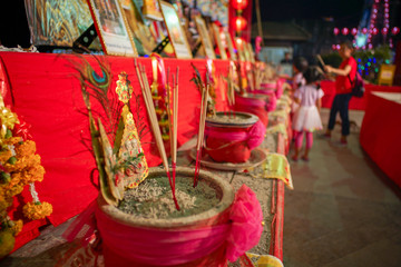 Selective focus on the fired incenses in the ashtray after praying.