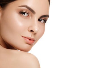 Fototapeta premium The beautiful female face. The perfect and clean skin of face on white