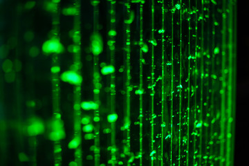 Abstract green bokeh background in selective focus. Bokeh bubbles abstract texture. Blurred bright light bubbles