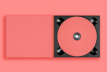 pastel pink cd in case on pastel pink background. - obrazy, fototapety, plakaty