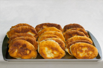 homemade fried pies on a metal tray