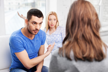 people, relationship difficulties and family therapy concept - couple with problem at psychologist office