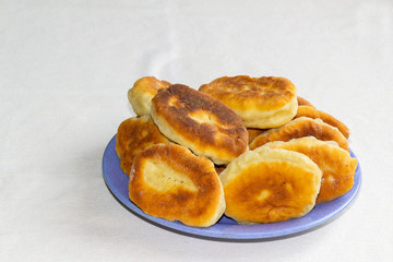 homemade fried pies on a blue plate