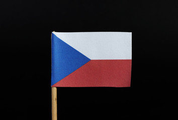 A official flag of the Czech republic on toothpick on black background. Czech is heart of Europe. Two equal horizontal bands of white and red with a blue isosceles triangle based on the hoist side
