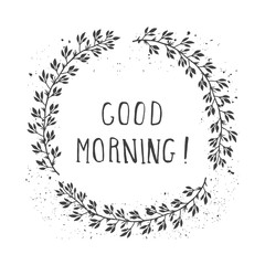 Vector hand drawn illustration of text GOOD MORNING! And floral round frame with grunge ink texture.