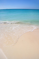 Beautiful white sand beach with turquoise sea & blue sky, Aruba
