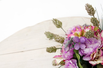 Composition of artificial flowers on a white background, isolated