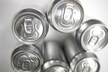 Cans of sweet drinks (or beer) soda cans