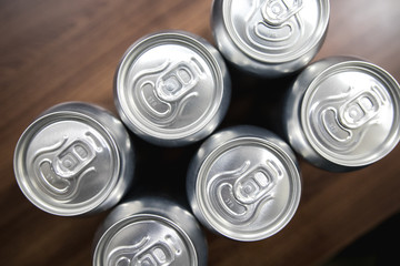 Cans of sweet drinks (or beer) soda cans