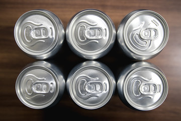 Cans of sweet drinks (or beer) soda cans