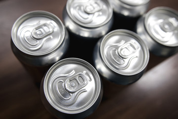 Cans of sweet drinks (or beer) soda cans