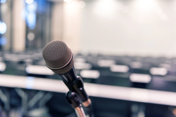 Microphone over the blurred business forum Meeting or Conference Training Learning Coaching Room Concept, Blurred background.